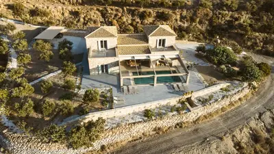 an aerial view of a house with a swimming pool at Villa Kalithea in Kissamos