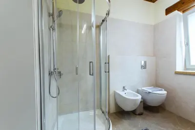 a bathroom with a shower and a toilet and a sink at Villa Kalithea in Kissamos