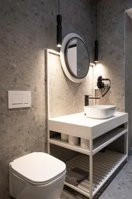 a bathroom with a white sink and a mirror at Citrus Daliani Rooms in Chania Town