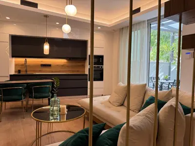 a living room with a couch and a table at Ethyr Atrium in Chania Town