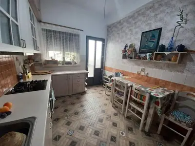 a kitchen with a sink and a counter top at Kristy's House with garden in Chania Town
