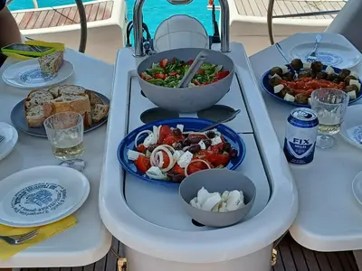 a table with a tray of food and bowls of food at Kristy's House with garden in Chania Town
