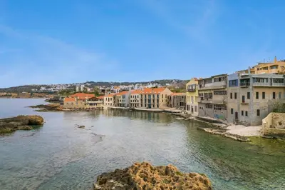 a view of a river with houses and buildings at Waves - Seaside Escape in Chania Town