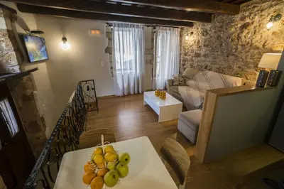 a living room with a table with fruit on it at Eulogia Casa in Chania Town