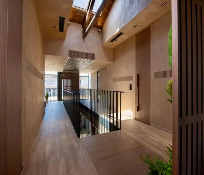 a hallway of a house with wooden floors and a staircase at Nearchou Boutique Hotel in Chania Town