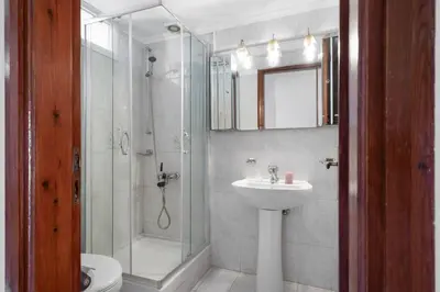 a bathroom with a shower and a sink and a toilet at STR Sodi The View in Chania Town