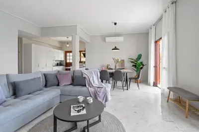 a living room with a couch and a table at STR Sodi The View in Chania Town