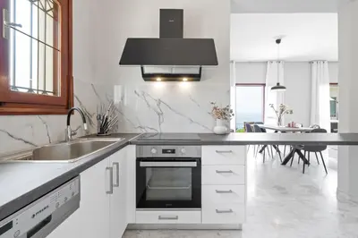 a kitchen with a sink and a stove top oven at STR Sodi The View in Chania Town