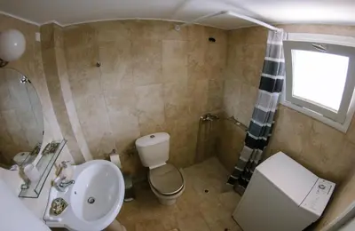 a bathroom with a toilet and a sink and a shower at La Fiora Old Town Chania in Chania Town