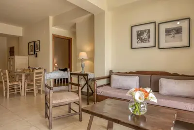 a living room with a couch and a table at Seli Chrysi - Apartment near the Sea in Kámbos