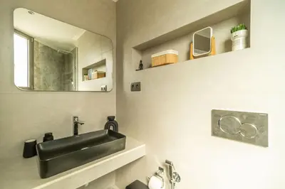 a bathroom with a black sink and a mirror at Venetian Villa by PosarelliVillas in Vamos