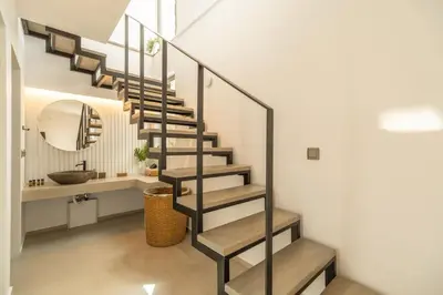 a staircase in a bathroom with a sink and a mirror at Venetian Villa by PosarelliVillas in Vamos
