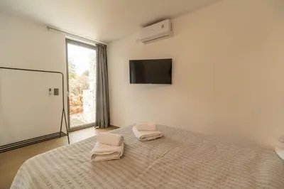 a bedroom with a bed with two towels on it at Venetian Villa by PosarelliVillas in Vamos