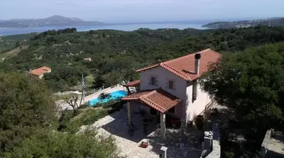 an aerial view of a house with a swimming pool at Villa Oneiro Tsivaras in Tsivarás