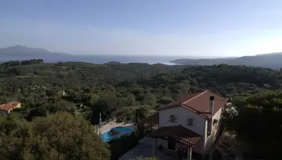 an aerial view of a house and a swimming pool at Villa Oneiro Tsivaras in Tsivarás