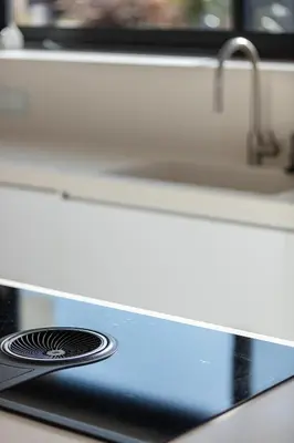 a close up of a stove top with a sink at Blue Olive Luxury Villa in Kounoupidhianá