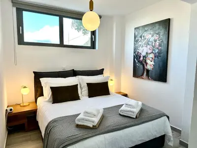 a bedroom with a bed with two towels on it at Villa Eleni, Vamos Sea & Mountain View with Pool in Chania
