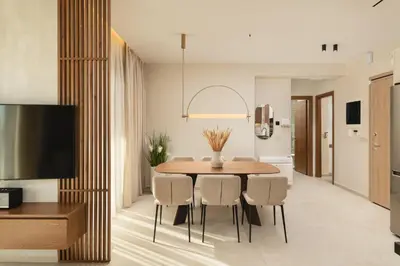 a dining room with a table and chairs at Lovelia Luxury Apartment Chania EV Car Wallbox in Chania Town
