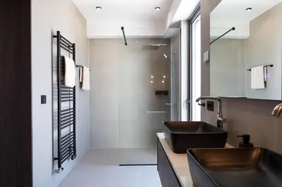 a bathroom with a sink and a shower at Villa Zenora in Litsárdha