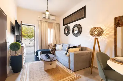 a living room with a couch and a table at Dreamscape Residences - Zephi Suite in Chania Town
