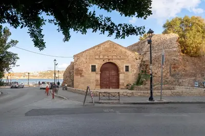 a stone building with a large door on the side of a street at Dreamscape Residences - Zephi Suite in Chania Town