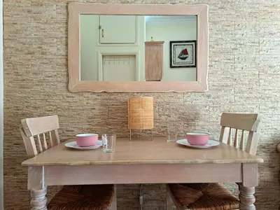 a table with two bowls and a mirror on a wall at Center studio 25 in Chania Town