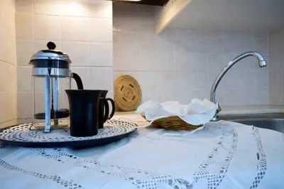 a tea kettle on a counter in a kitchen at Penthhouse Studio next to the beach in Souda