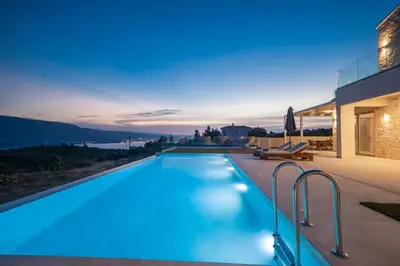 a swimming pool with blue lights on a house at Fantasea Villas, villa Lux in Galangádhos