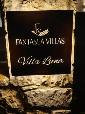 a sign for the entrance to a villa lauren at Fantasea Villas, villa Lux in Galangádhos