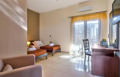 a living room with a couch and a bed and a table at Modern Interior Villa in Chania Town