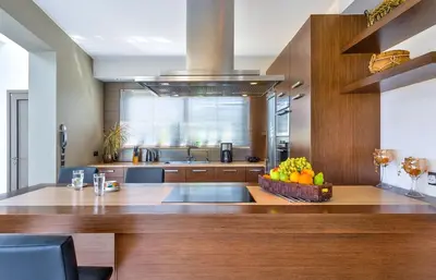 a kitchen with a bowl of fruit on a counter at Modern Interior Villa in Chania Town