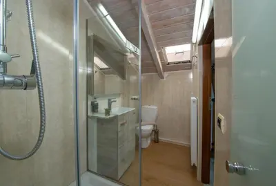a bathroom with a toilet and a glass shower at Villa Splantzia - Heated pool - Garden in Chania Town
