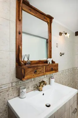 a bathroom with a sink and a mirror at Villa Splantzia - Heated pool - Garden in Chania Town