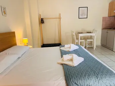 a bedroom with two beds with towels on them at Kd's apartment B in Chania Town