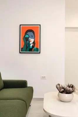 a living room with a green couch and a table at Alma & Nina Apt in Chania Town