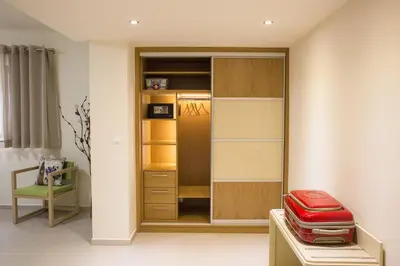 a room with a closet with a red suitcase at Campagna Mare in Kissamos