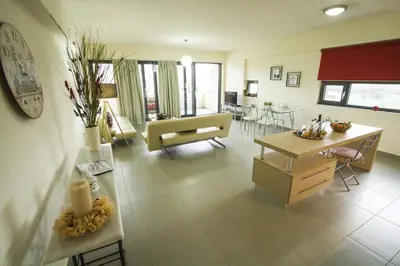 a living room with a couch and a table at Campagna Mare in Kissamos