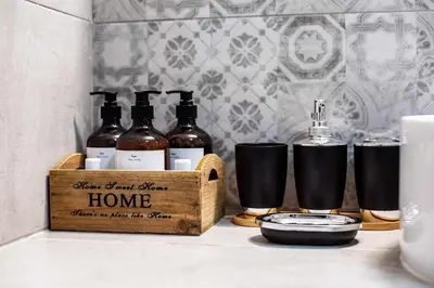 a wooden crate with bottles of wine on a counter at Kamari Petit Studio & Apartment - Chania in Chania Town