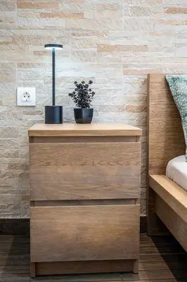a wooden dresser with two plants on top of it at Kamari Petit Studio & Apartment - Chania in Chania Town