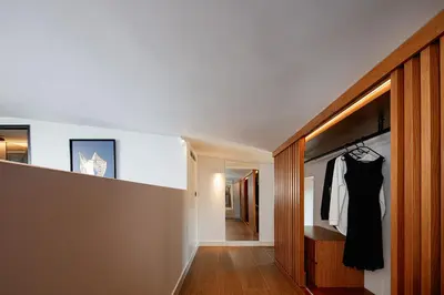 a dressing room with a black dress hanging on a closet at Villa Mika in Chania Town