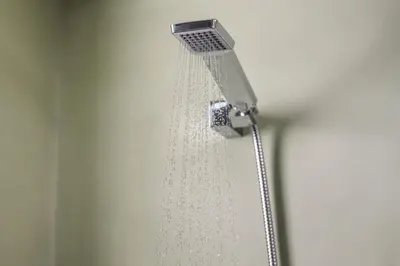 a shower head with water coming out of it at Pantanassa Villas in Agia Marina Nea Kydonias
