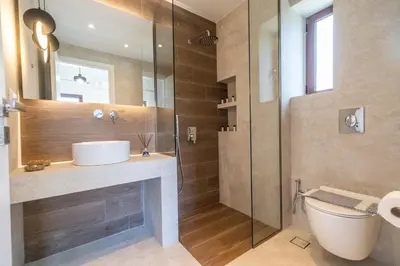 a bathroom with a sink and a shower at Villa Aetheria by PosarelliVillas in Plátanos