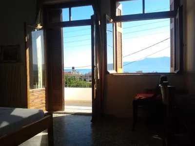 a room with an open door with a view at Three Bedroom Apartment in City Center with Sea View near the Beach in Kissamos