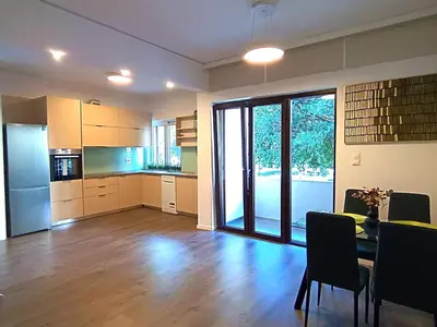 a living room with a kitchen and a dining room at Casa Dina Nea Chora in Chania Town
