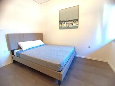 a bed in a room with a picture on the wall at Casa Dina Nea Chora in Chania Town