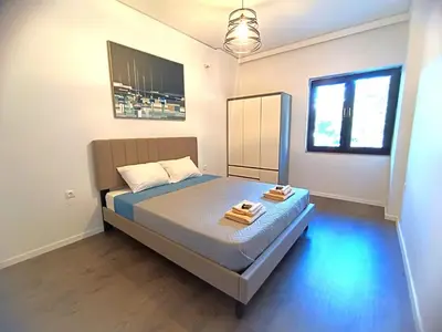 a bedroom with a bed with two towels on it at Casa Dina Nea Chora in Chania Town
