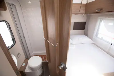 a small room with a bed and a toilet at CamperLifeCrete in Chania Town