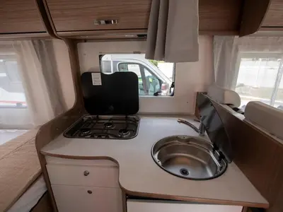 a small kitchen with a sink in an rv at CamperLifeCrete in Chania Town