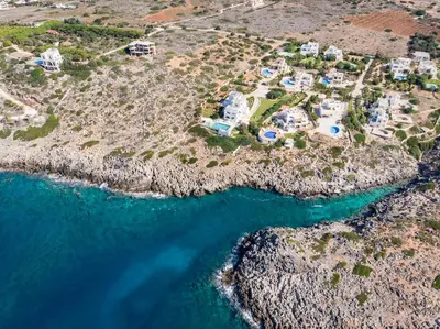 an aerial view of a resort next to the ocean at Tersanas Sea Front Villas in Tersanas