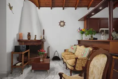 a living room with a couch and a table at Seaside House in Chania Town